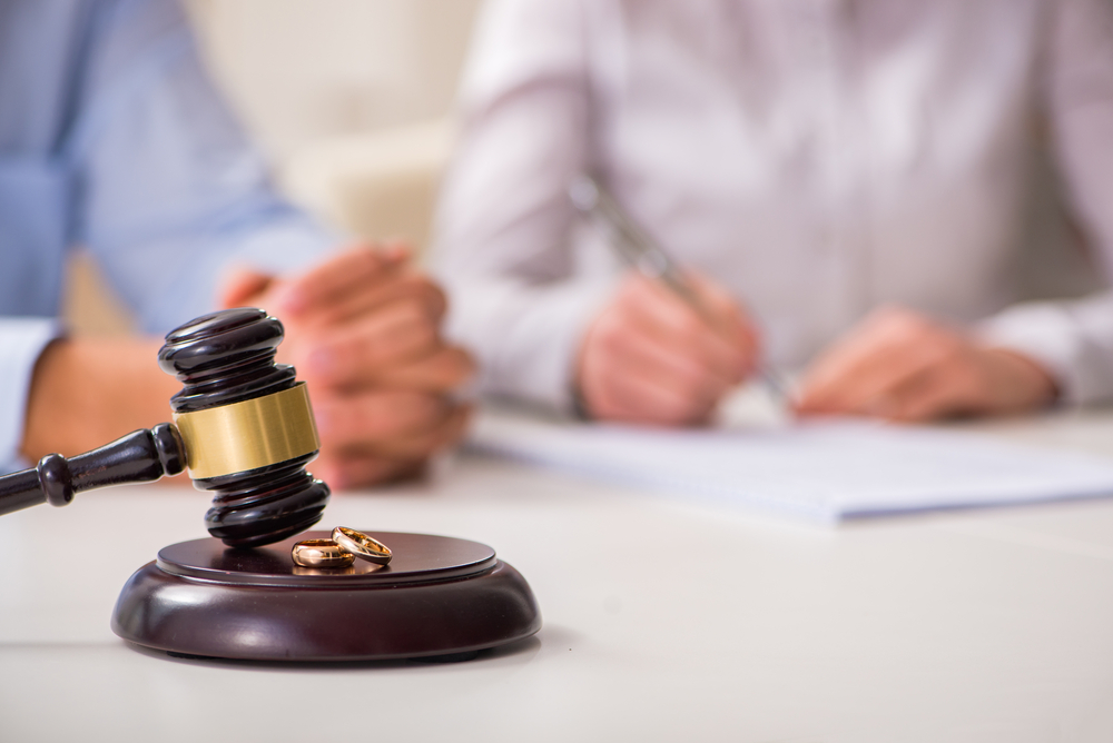 Judge gavel deciding on marriage divorce